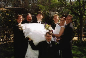Posed_Groomsman_Holding_Deb.jpg