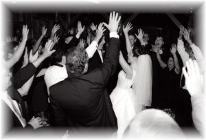 Reception_Barn_-_Group_Dancing_Hands_in_the_Air.jpg